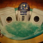 R2D2 in the hot tub with some fine appliances.